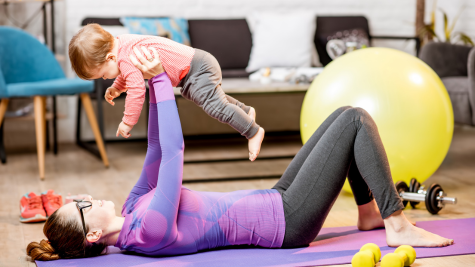 A mum exercising with her child