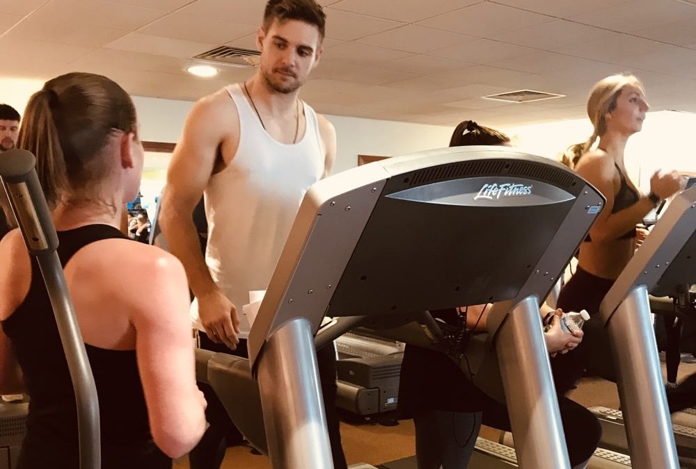 ybfit training gym instructor training person on treadmill